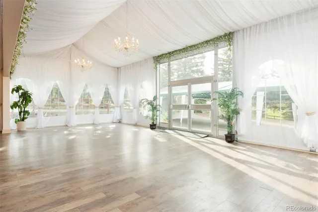 a view of a garden with an outdoor seating