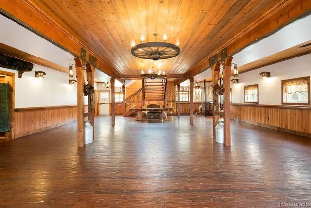 a view of a livingroom with furniture window and wooden floor