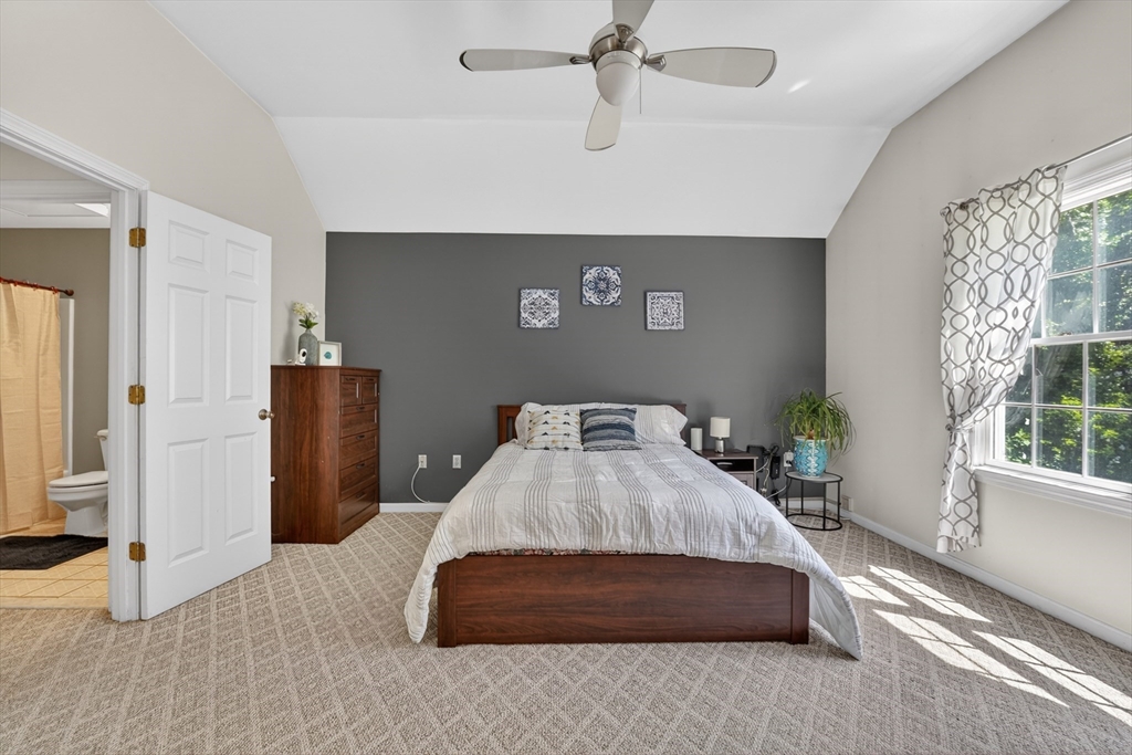 15 Evergreen Circle, Unit 15 Canton, MA 02021 - Photo 16 of 29 a bedroom with a bed and large window