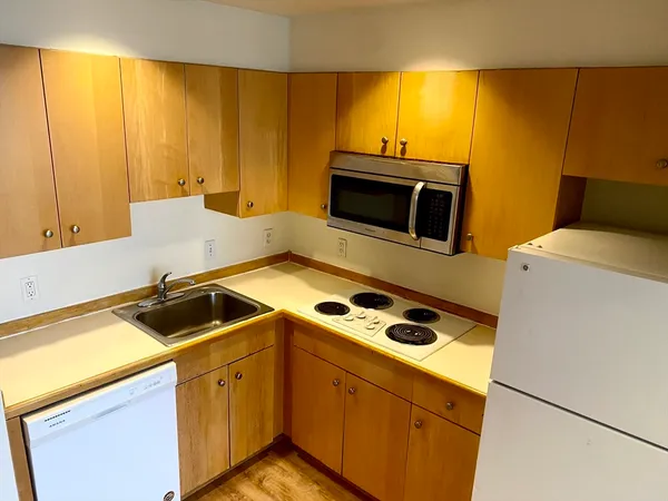 a kitchen with a sink and cabinets