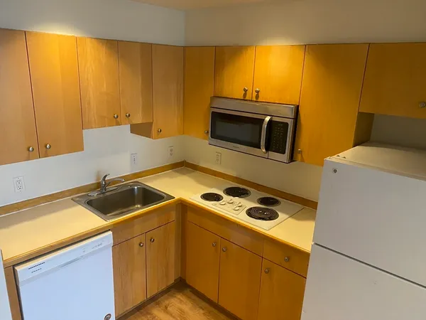 a kitchen with a sink and a microwave