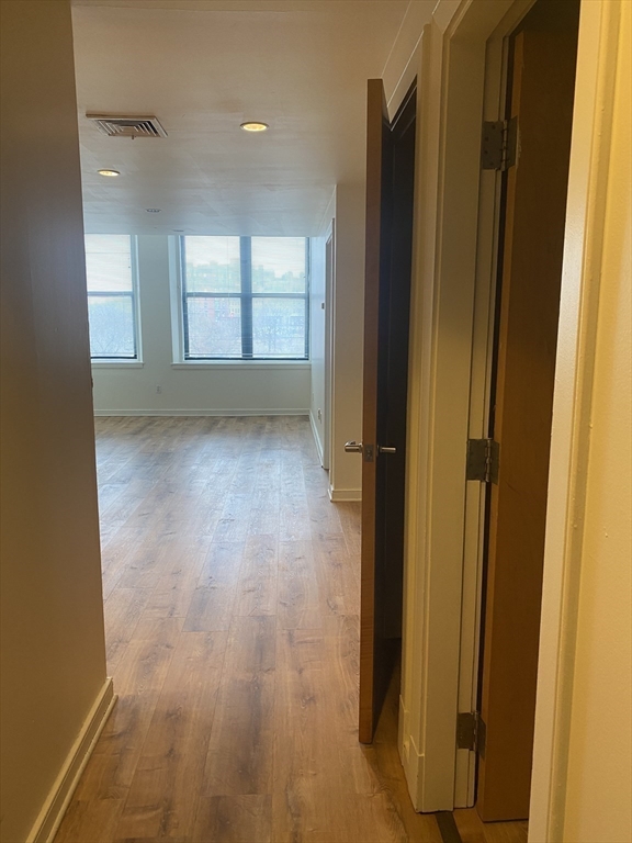 131 Tremont Street, Unit 5B Boston, MA 02111 - Photo 18 of 24 a view of an empty room with window and bathroom