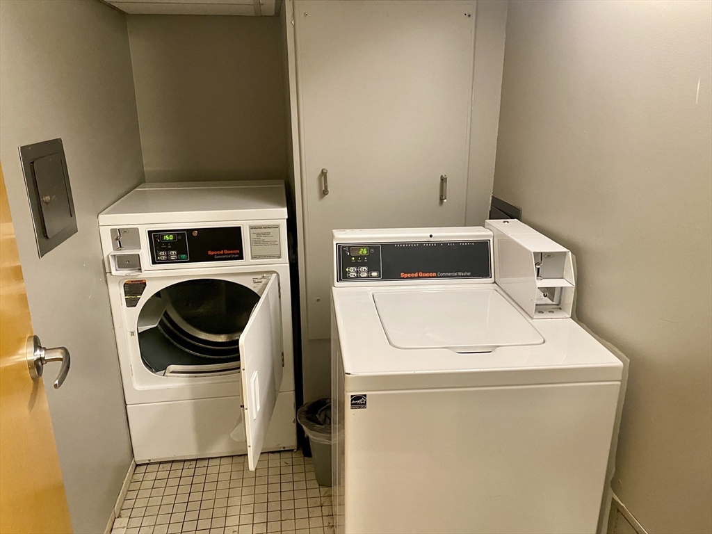 131 Tremont Street, Unit 5B Boston, MA 02111 - Photo 21 of 24 a utility room with dryer and washer