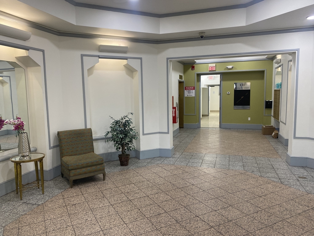131 Tremont Street, Unit 5B Boston, MA 02111 - Photo 24 of 24 a living room with furniture and a potted plant