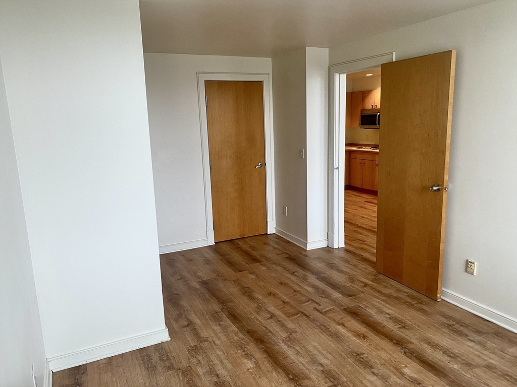 131 Tremont Street, Unit 5B Boston, MA 02111 - Photo 7 of 24 a view of bedroom with wooden floor