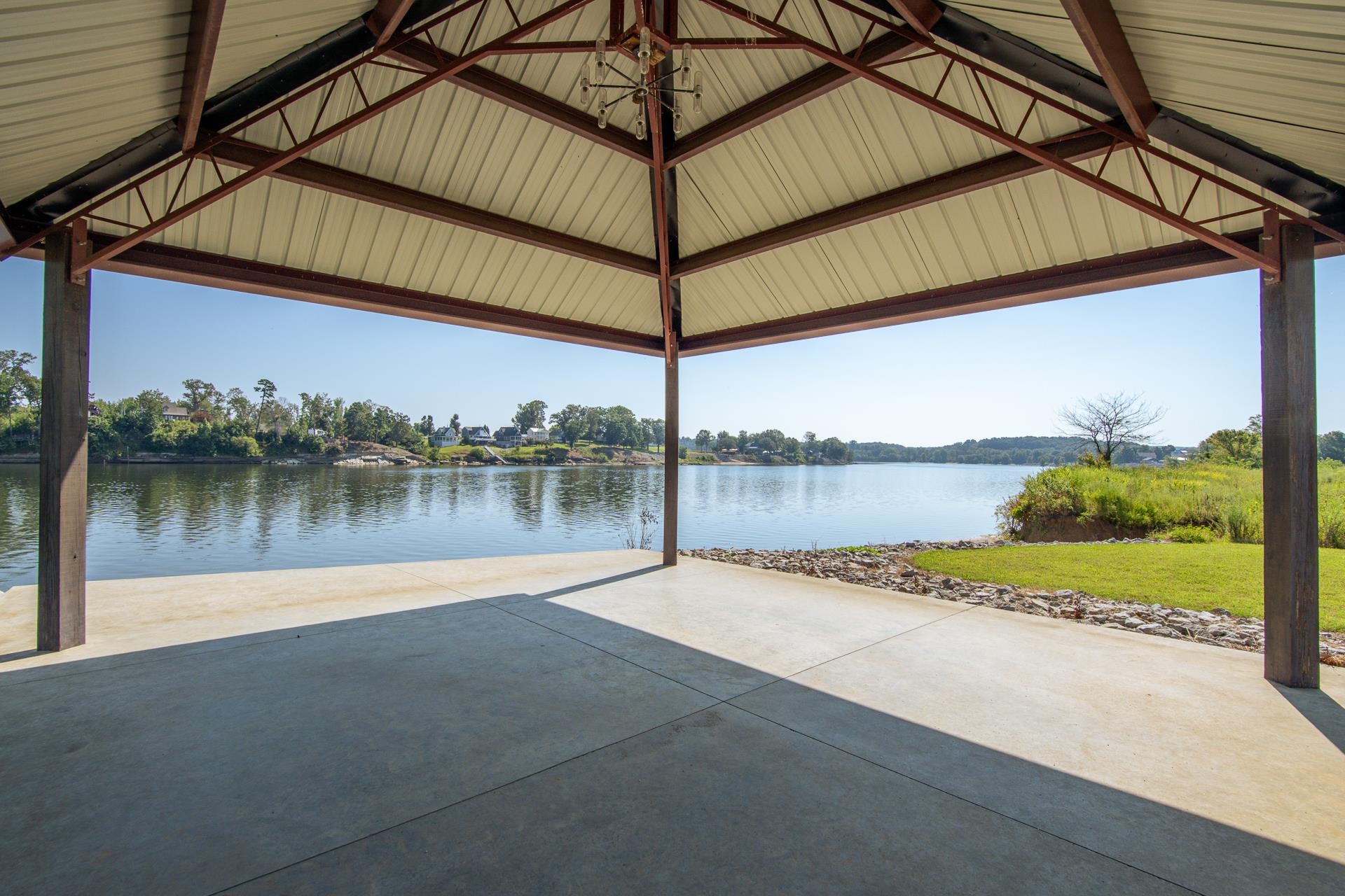 6235 Cravens Road Savannah, TN 38372 - Photo 10 of 11 Dock area featuring a water view, a yard, and a patio area