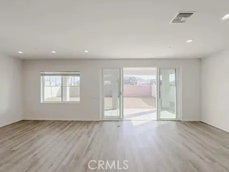 a kitchen with stainless steel appliances granite countertop a sink a stove top oven a refrigerator and dishwasher