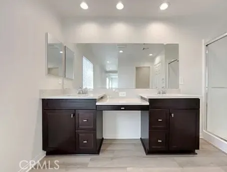 a kitchen with a sink and a mirror
