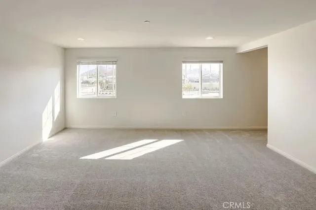 a view of an empty room with a windows