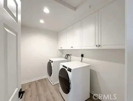 a room with pool table and windows