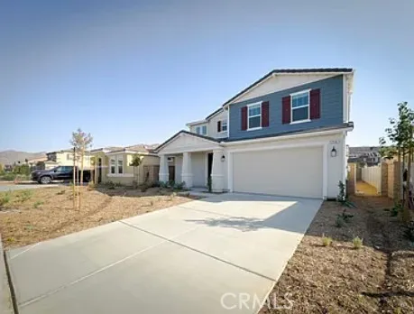 a large kitchen with a lot of counter space and stainless steel appliances