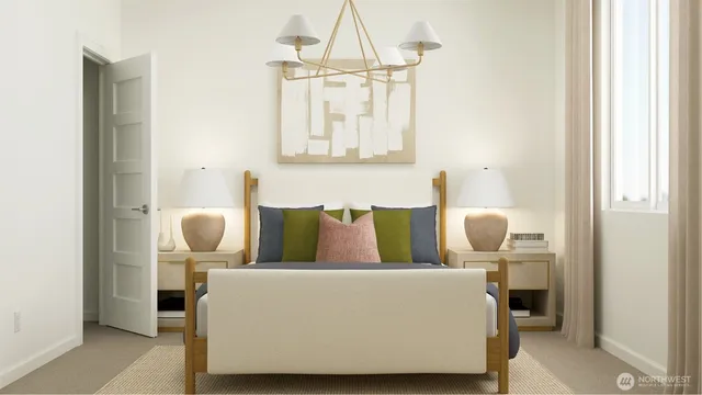 a living room with a couch and chandelier