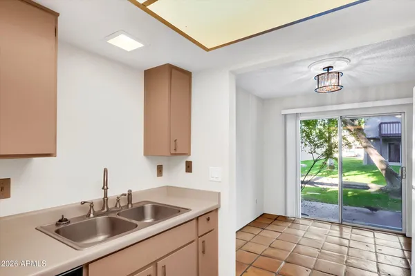 a kitchen with a sink and a window