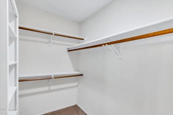 a view of an empty walk in closet