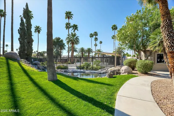 a view of a house with a porch and a garden