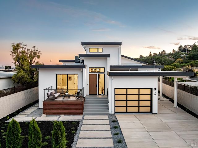 a view of a patio with table and chairs with wooden floor and fence