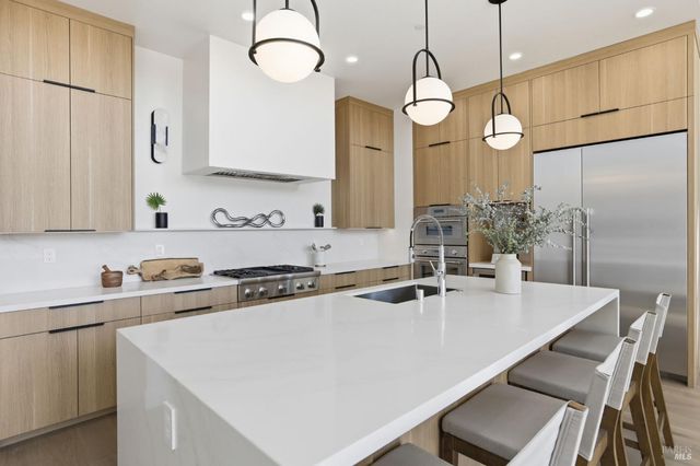 a living room with fireplace furniture and a floor to ceiling window