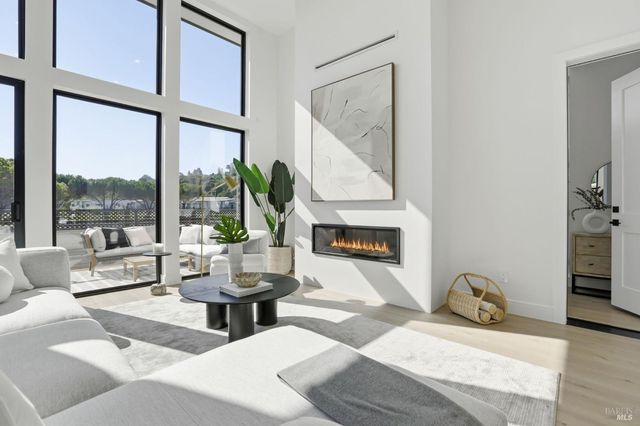 a bathroom with a tub sink and mirror