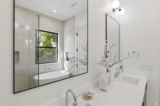 a bedroom with a bed and a lamp