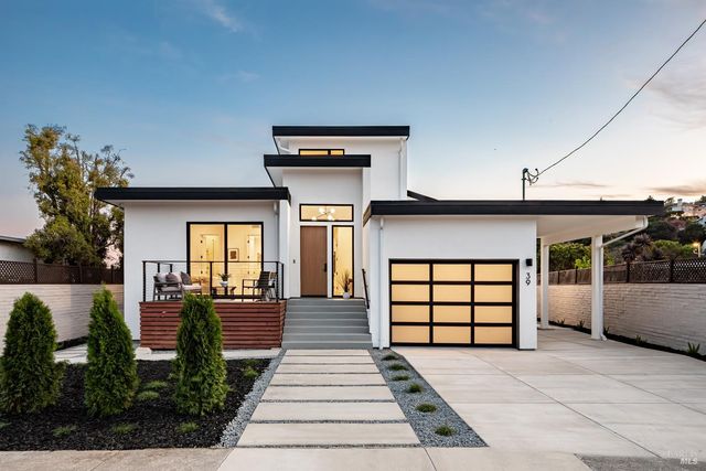 a front view of a house with a yard
