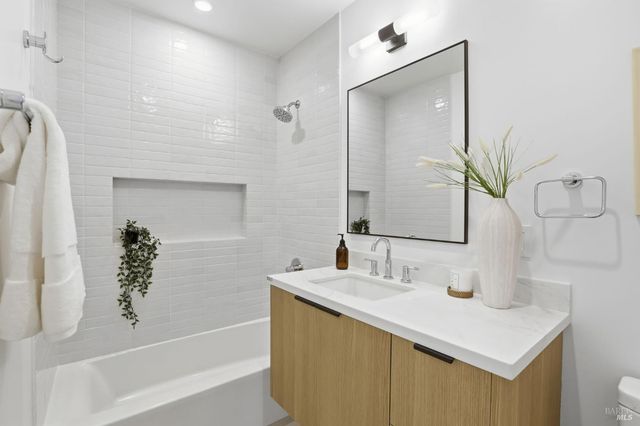 a bedroom with a bed and night stand