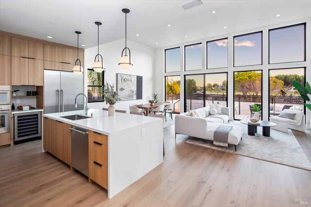 a black and white stove sitting inside of a kitchen