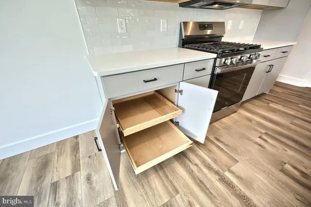 a kitchen with sink and cabinets