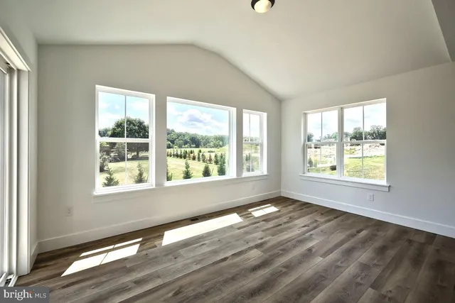 a view of a kitchen with a sink and a window