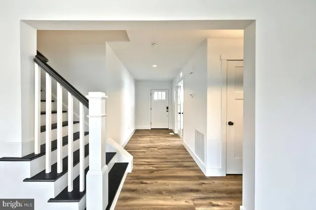 a view of entryway with wooden floor