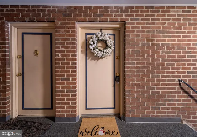 a living room with furniture plant and a large window