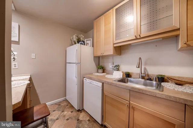 a bathroom with a granite countertop sink a mirror and a vanity