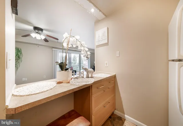 a kitchen with a sink a stove top oven and cabinets