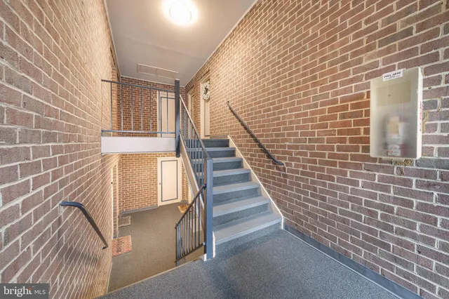 a view of an empty room and a window