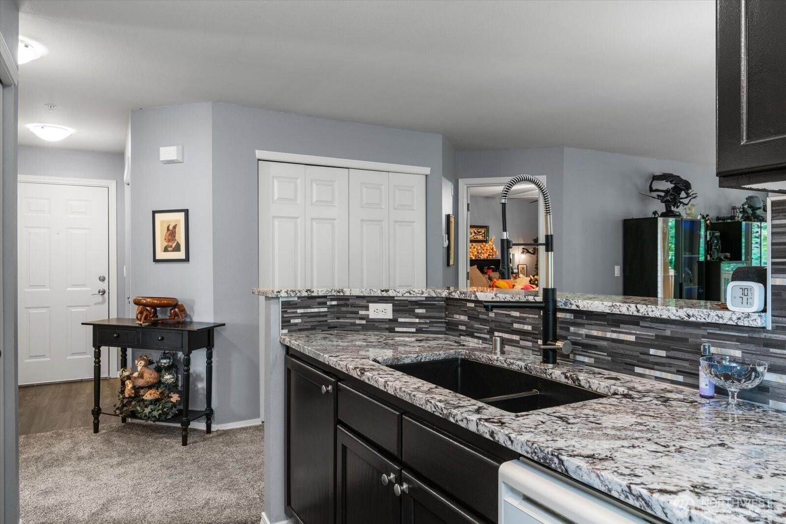 723 114th Street Southwest, Unit Y203 Everett, WA 98204 - Photo 11 of 35 a kitchen with stainless steel appliances granite countertop a sink and a stove