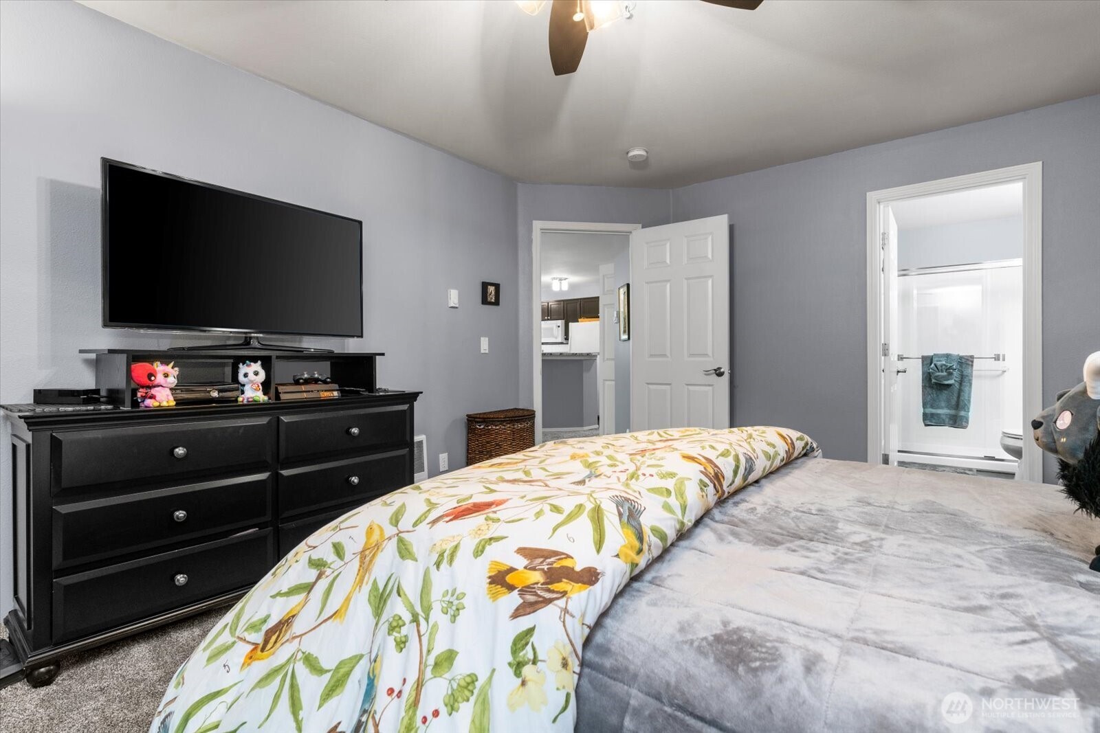 723 114th Street Southwest, Unit Y203 Everett, WA 98204 - Photo 18 of 35 a bedroom with a bed and a flat screen tv
