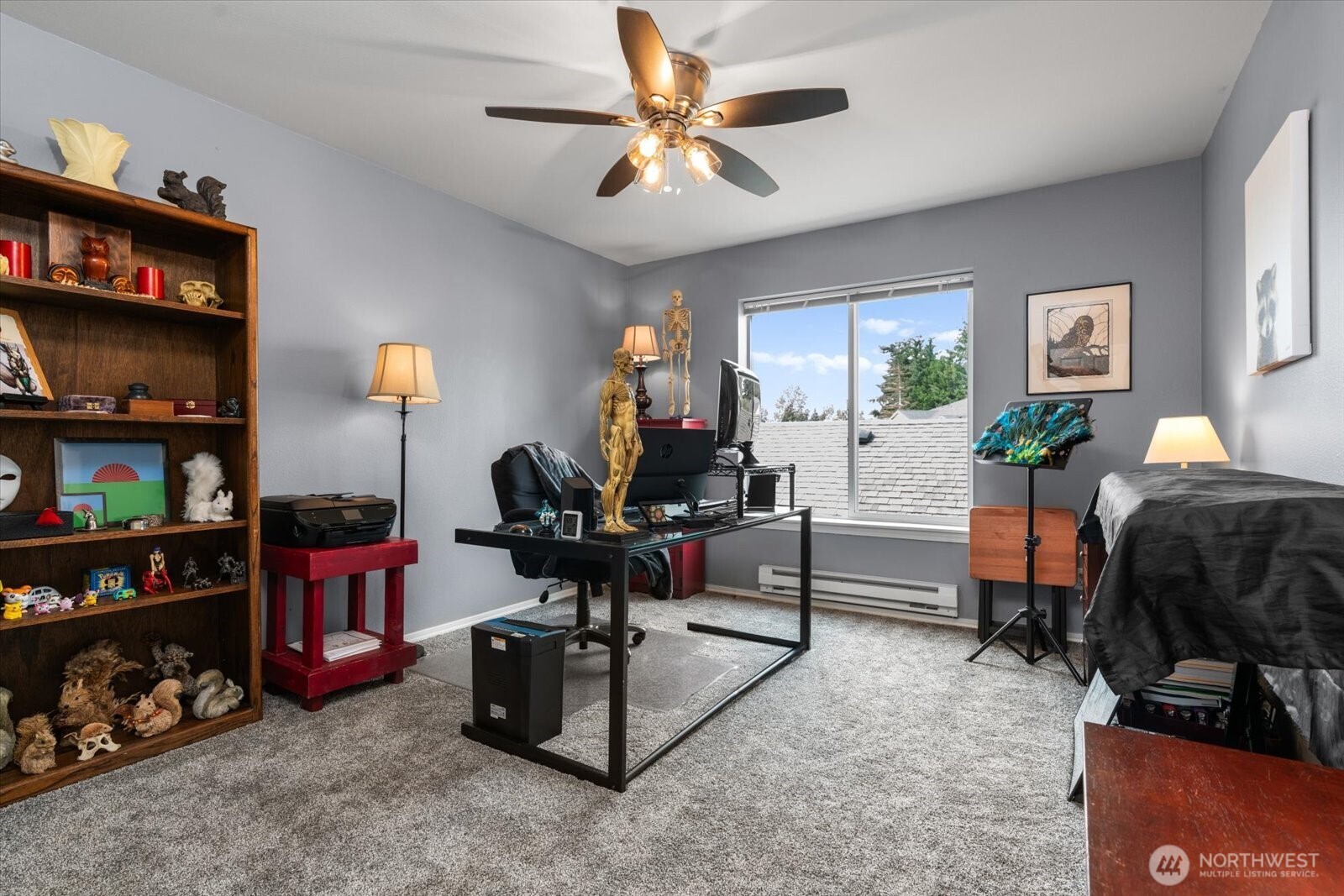 723 114th Street Southwest, Unit Y203 Everett, WA 98204 - Photo 23 of 35 a living room with furniture a bookshelf and a window