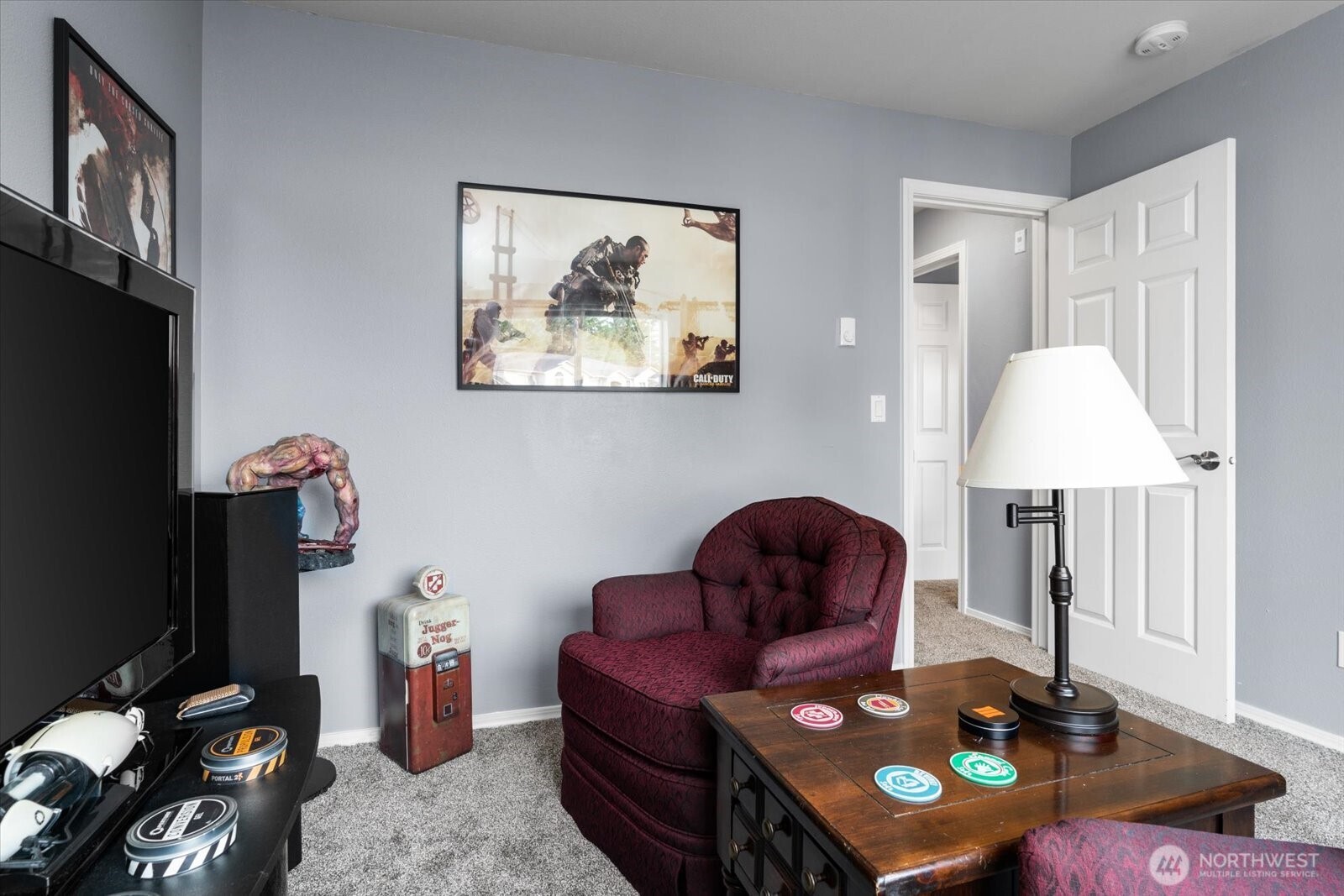 723 114th Street Southwest, Unit Y203 Everett, WA 98204 - Photo 25 of 35 a living room with furniture and a flat screen tv