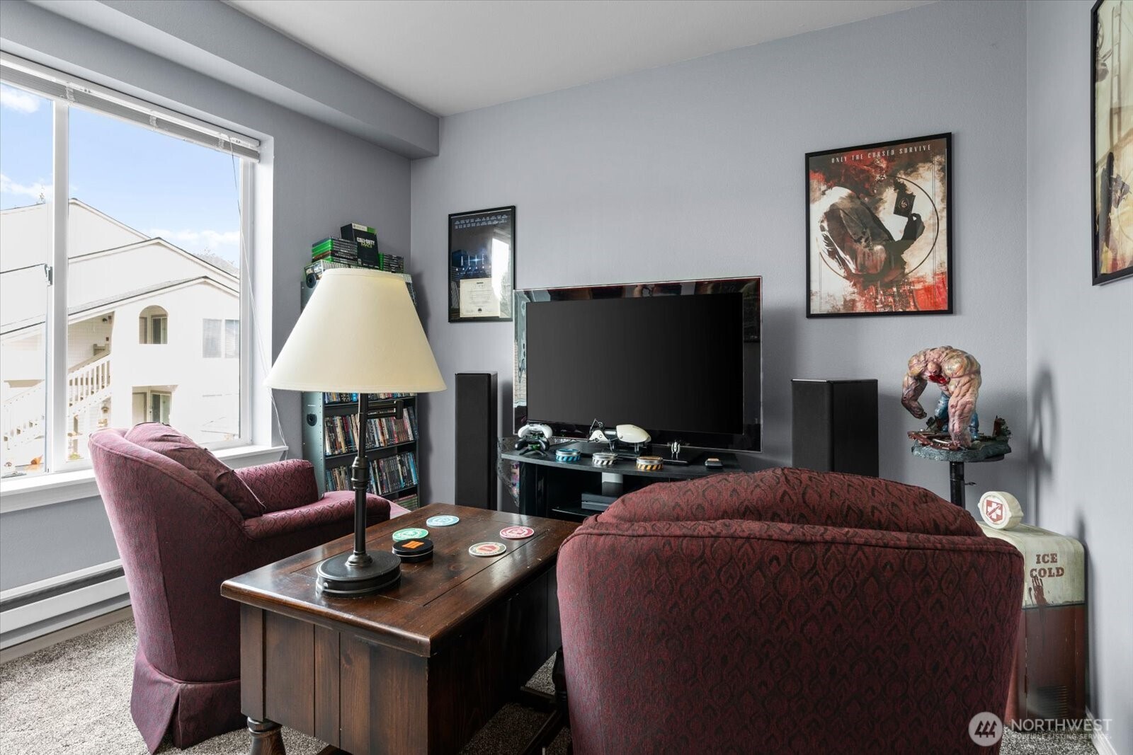 723 114th Street Southwest, Unit Y203 Everett, WA 98204 - Photo 26 of 35 a living room with furniture a flat screen tv and a floor to ceiling window