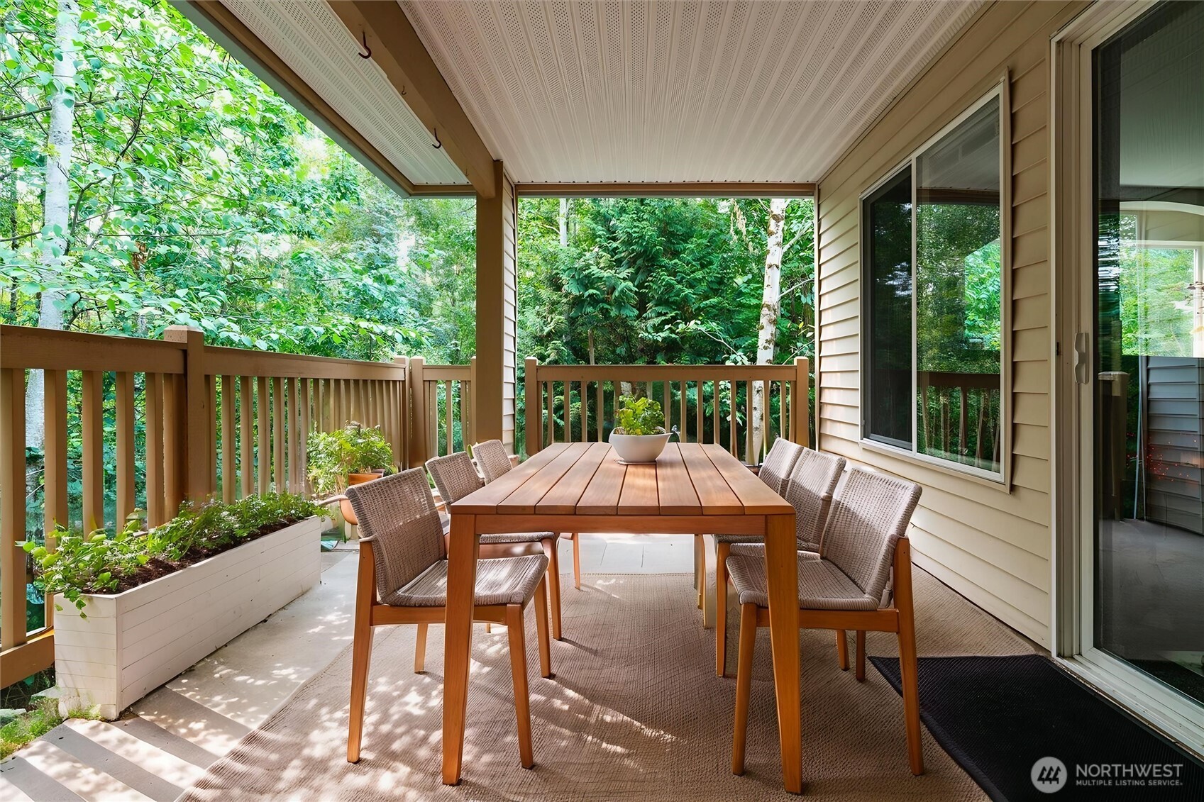 723 114th Street Southwest, Unit Y203 Everett, WA 98204 - Photo 30 of 35 a view of a patio with a table chairs and a backyard