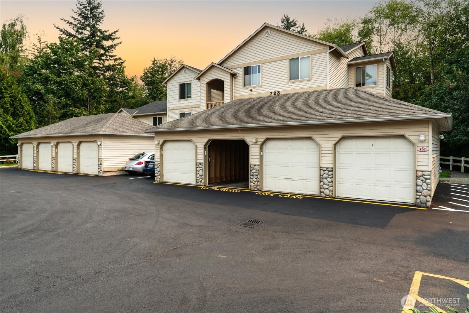723 114th Street Southwest, Unit Y203 Everett, WA 98204 - Photo 32 of 35 a view of a house with a yard and garage