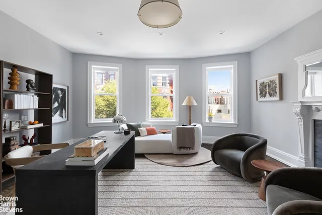 a bathroom with a double vanity sink a mirror and shower