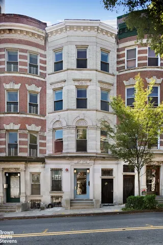 a view of roof deck with a barbeque and wooden stairs