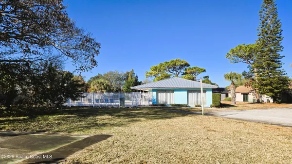 a house with swimming pool in front of it