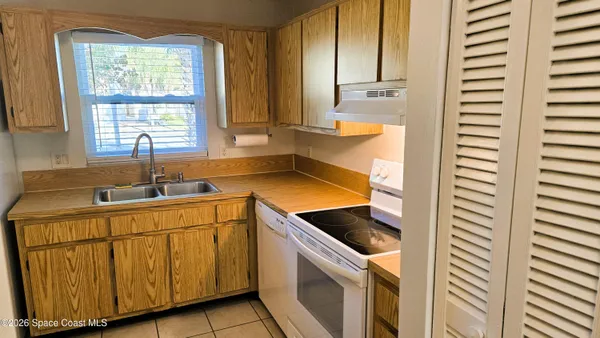 a kitchen with a sink and a stove