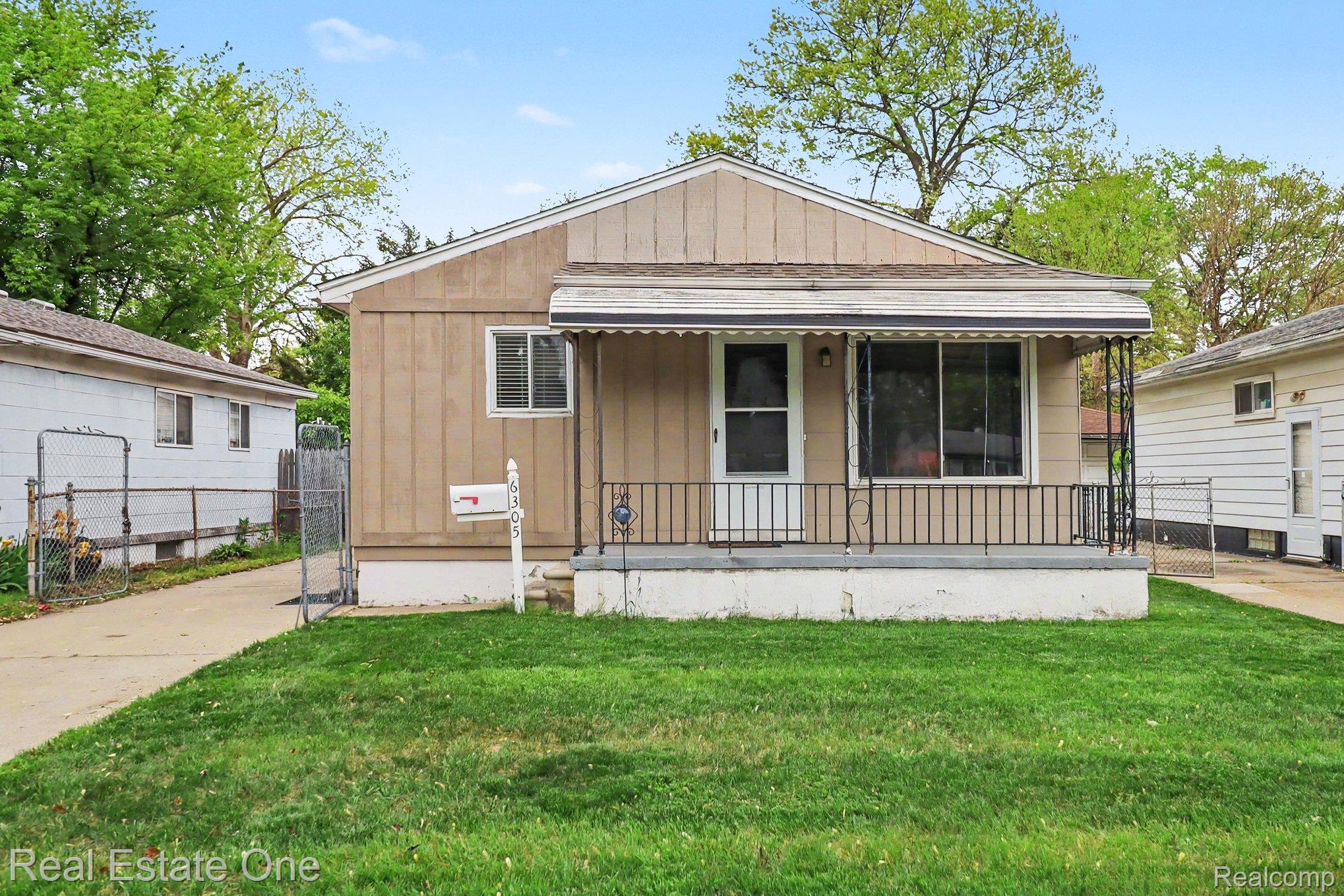 6305 Beech Daly Road Taylor, MI 48180 - Photo 1 of 22 View of front facade with covered porch and board and batten siding