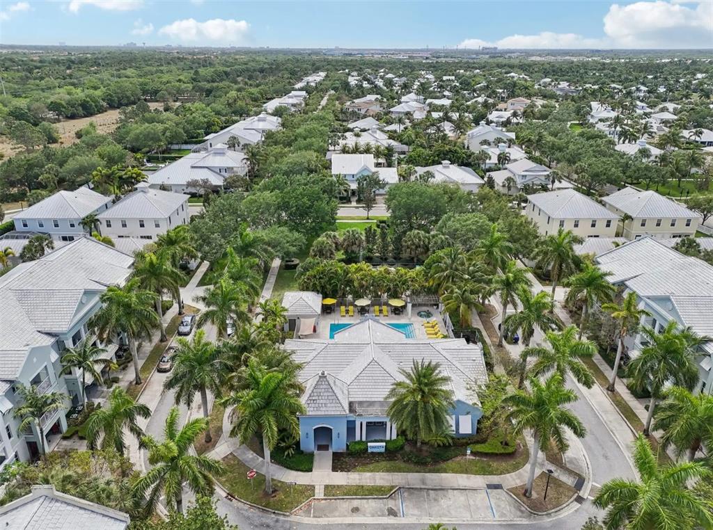 3334 South Bismark Lane, Unit 1B01304 Jupiter, FL 33458 - Photo 24 of 36 an aerial view of residential houses with outdoor space