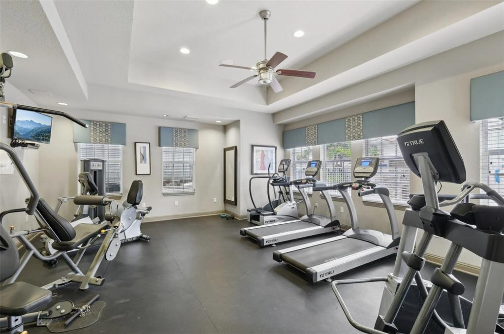 3334 South Bismark Lane, Unit 1B01304 Jupiter, FL 33458 - Photo 31 of 36 a view of a room with gym equipment