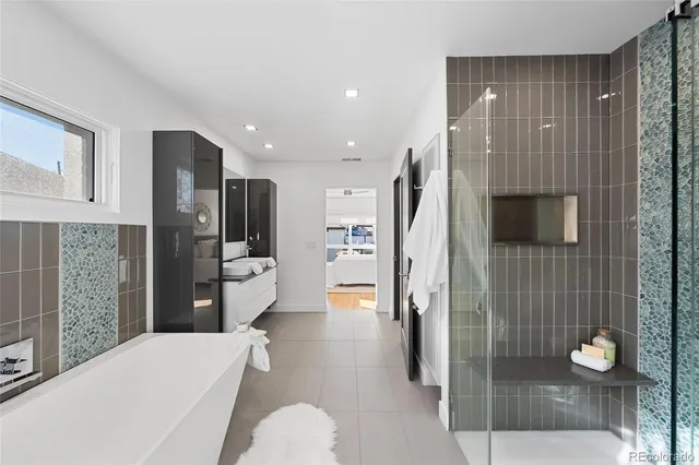 a view of swimming pool with outdoor seating and plants