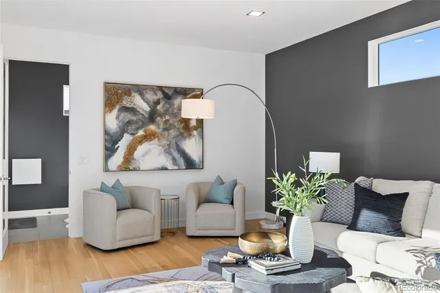 a view of a backyard with plants and brick wall