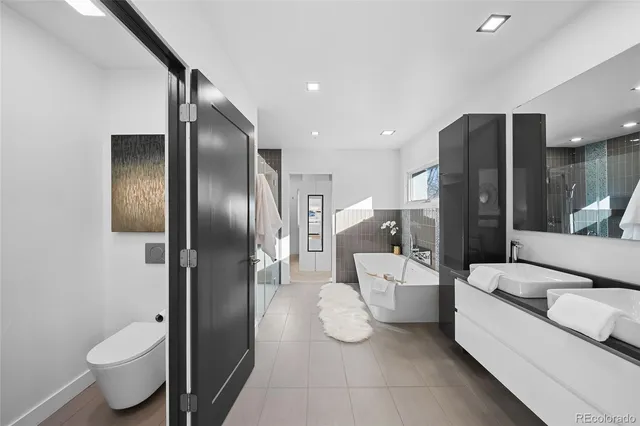 a dining room with furniture and a mirror